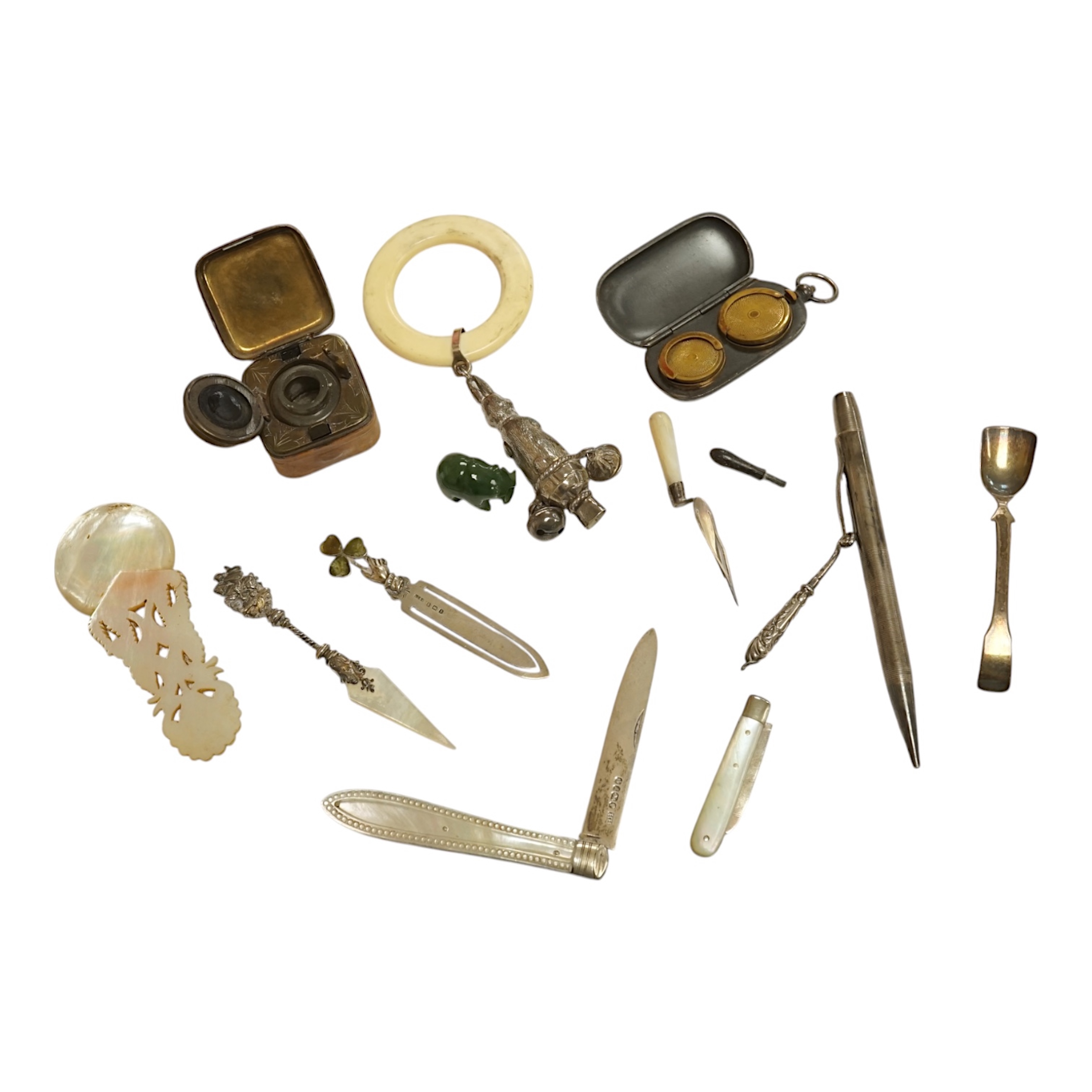 A small collection of mainly small silver items including a Victorian fruit knife, bookmarks, hare child's rattle, etc. Condition - fair